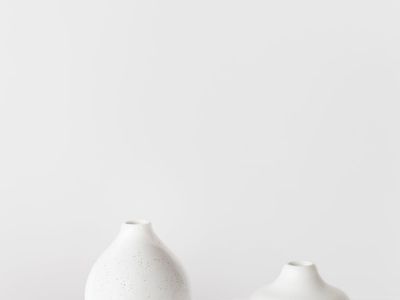 An empty, clean wooden floor suggesting a space for movement and practice.